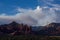 Smoke fills the blud sky behind the Red Rocks of Sedona, Arizona during the Slide Fire, north of Sedona, Arizona