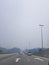 Smoke haze shrouds Kuala Lumpur highway as the result of forest burning in Indonesia