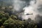 smoke from helicopter's engine fills the jungle as it flies past trees