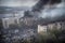 Smoke rise from burning bombed destroyed building