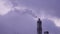 Smoke rises from the chimney. Industrial plant with high chimney and steam cloud