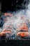 Smoke rising from a traditional Romanian Mici barbeque