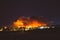 Smoke from Sand brush fire covering Santa Clarita cityscape at sunset in California