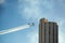 Smoke squadron planes perform acrobatics between residential buildings