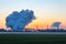 Smoke Stack from Chimney of Chemical Plant at Sunrise