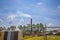 A smoke stack in the distance at an industrial plant