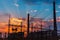 Smoke stacks at coal burning power plant, industrial silhouette.