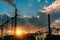 Smoke stacks at coal burning power plant, industrial silhouette.