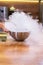 Smoke vapor dry ice in bowl in kitchen