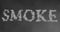 Smoke word made by floating smoke steam through space on grey blur background, danger health