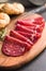 Smoked bresaola. Italian appetizer. Dried beef meat on cutting board