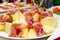 Smoked ham and cheese appetizers on a buffet