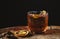 Smoked old fashioned cocktail on dark wooden background