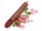 Smoked salami decorated with flowers over white ba