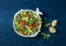 Smoked salmon, avocado, arugula, red onion salad. Healthy snacking on blue background