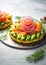 Smoked salmon with avocado and red onion on potato cakes