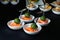 Smoked salmon canape with mousse, bonded with bamboo sticks.