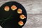 Smoked salmon canapes with cheese cream and dill served on black slate platter