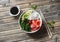 Smoked salmon sushi bowl on wooden background, top view. Rice, avocado puree, salmon - healthy food