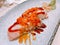 Smoked salmon sushi topped with shrimp eggs.
