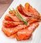 Smoked salmon on white dish with chive