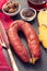 Smoked sausage chourico with corn bread on black background