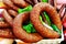 Smoked sausage in the form of a ring on the counter of the grocery store. Trade in meat products