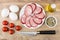 Smoked sausage in plate, tomatoes, eggs, spices, vegetable oil