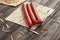 Smoked sausages, cabbage and pita bread isolated on wooden background