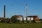 Smokestack billowing from a small plant