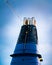 Smokestack on a large cruise ship with light chains and moody sky