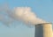 Smokestack of a thermal power plant against a blue sky