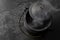 Smoking Black Iron Cauldron on a Dark Gray Slate Background