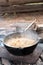 Smoking cauldron with pilaff cooking. Vertical image, series