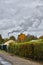 Smoking chimney behind garden plots