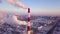 Smoking chimney on industrial plant aerial landscape. Drone view smokestacks on industrial area at heating plant. Boiler