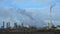 Smoking chimneys and smoke stacks of large chemical factory during winter season. Location Duslo Sala, western Slovakia.