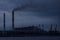 smoking cooling towers of coal power plant against the evening
