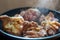 Smoking cuts of meat in a frying pan. The process of cooking meat