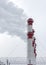 Smoking pipes of a thermal power plant, against the background of a winter sky