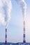 Smoking pipes of thermal power plant emitting carbon dioxide in the atmosphere. Concept of environmental pollution