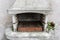Smoky antique brick oven outdoor with ashes inside. Old garden heater. grill usable for BBQ. patio Vienna, Austria