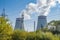 The smoky chimneys of the power plant stand against the blue sky