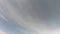 Smoky clouds move slowly across the sky. Timelapse.