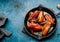 Smoky roast chicken wings in cast iron pan