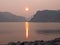 Smoky sunset at mountain lake