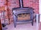 Smoldering cast iron wood stove saving energy