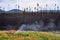 A smoldering forest fire still smokes near the Yukon.