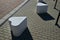 Smooth concrete chair-sized castings. suitable as an urban design barrier to enter the pedestrian zone. shape of mocha sugar cubes