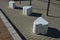 Smooth concrete chair-sized castings. suitable as an urban design barrier to enter the pedestrian zone. shape of mocha sugar cubes